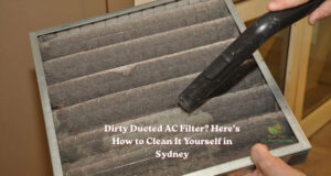 a man is cleaning dirty ducted air conditioner filter