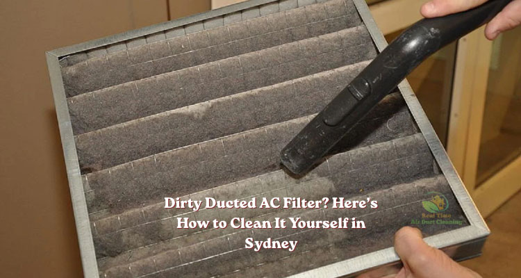 a man is cleaning dirty ducted air conditioner filter
